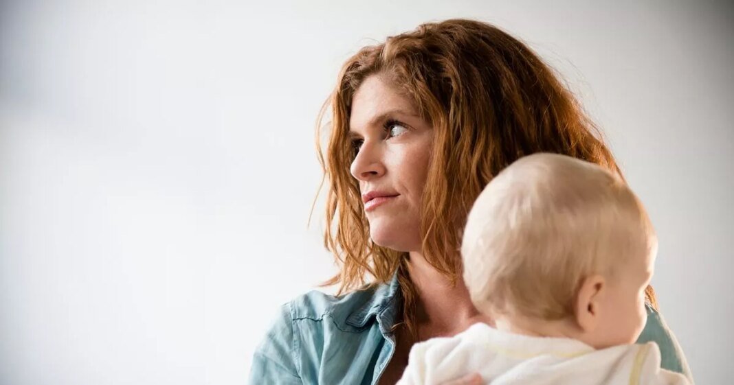 0_frustrated-caucasian-mother-holding-baby-son